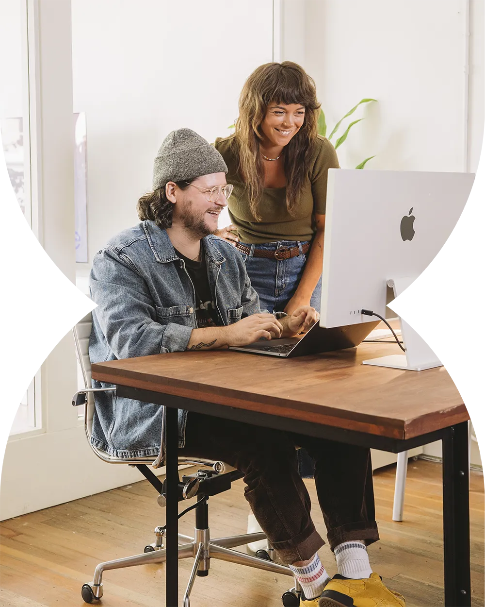 us-smiling-and-pretending-to-look-at-something-on-the-computer-desktop