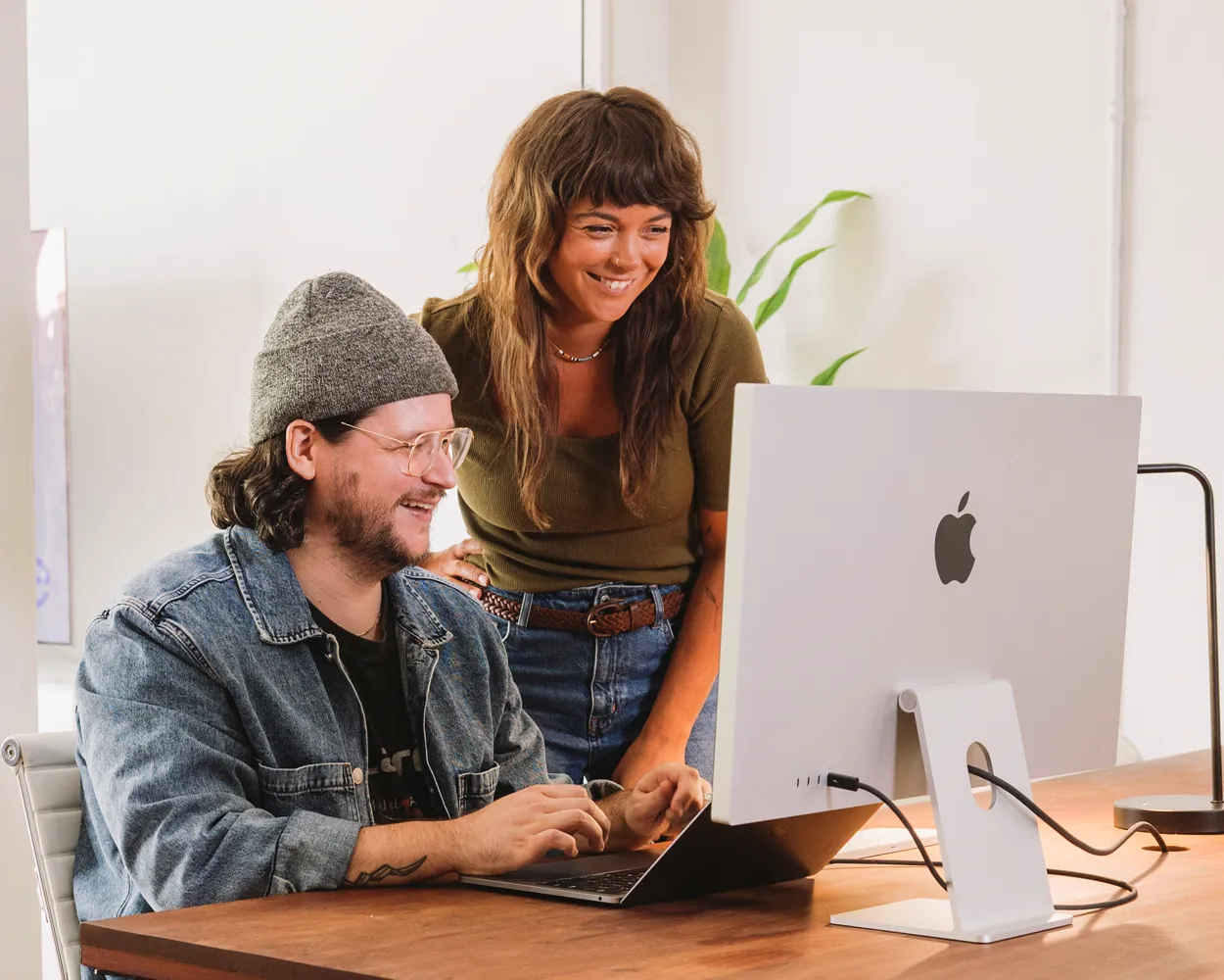 us-smiling-and-pretending-to-look-at-something-on-the-computer-mobile